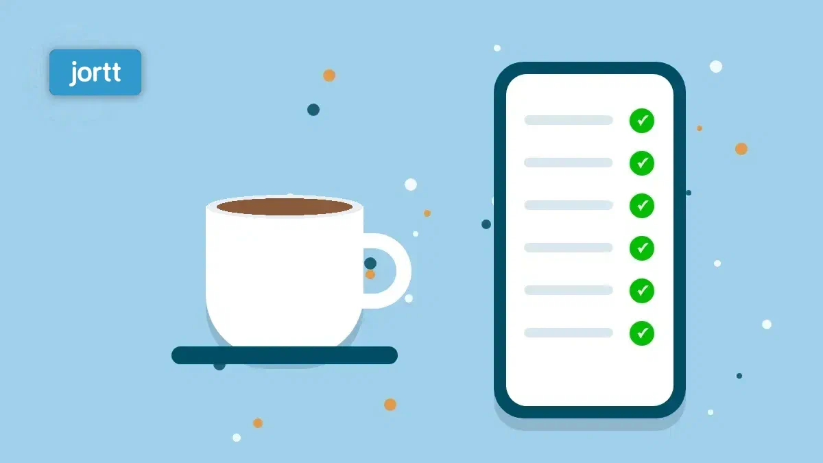 Een kop koffie naast een telefoon met een boekhouding die al klaarstaat