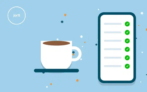 Een kop koffie naast een telefoon met een boekhouding die al klaarstaat